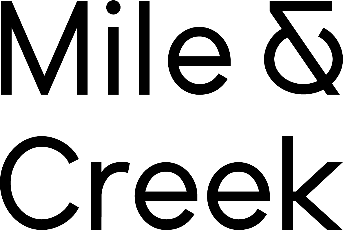 Mile and Creek Condos logo