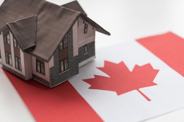 wooden house flag canada finance Bank of Canada’s interest rate announcement - Implications for the Canadian real estate market and economy